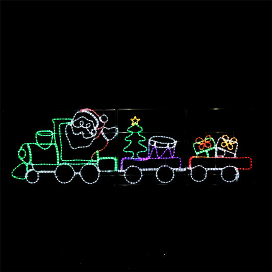 LED Christmas train with Santa, a Christmas tree and gifts lit up at night