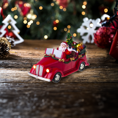 Babbo Natale in macchina con albero che gira